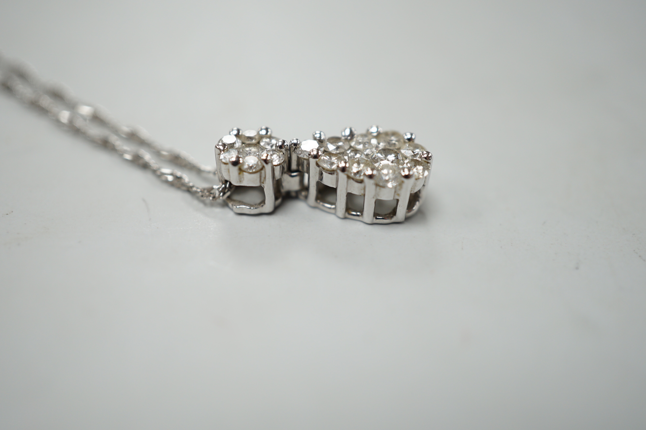 A modern 14kt white metal and pave set diamond set pear shaped pendant necklace, 52cm, gross weight 4.2 grams.